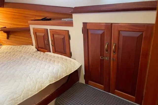 Slide: The Image of Interior of 1988 Holland Wesmac-Foley Flybridge Cruiser with wooden cabinetry. - 40