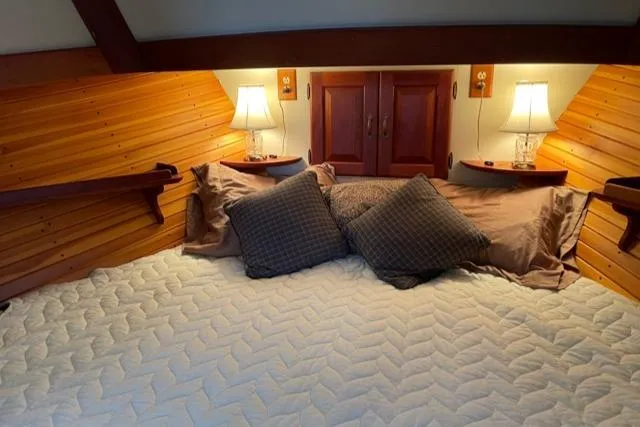 Slide: The Image of Cozy bedroom on a 1988 Holland Wesmac-Foley Flybridge Cruiser. - 42