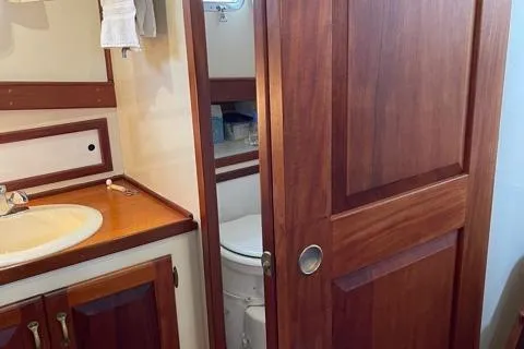 Slide: The Image of Interior of 1988 Holland Wesmac-Foley Flybridge Cruiser with wood paneling. - 44