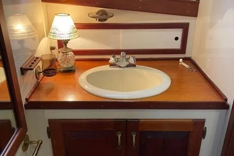 Slide: The Image of Bathroom sink in a 1988 Holland Wesmac-Foley Flybridge Cruiser. - 46