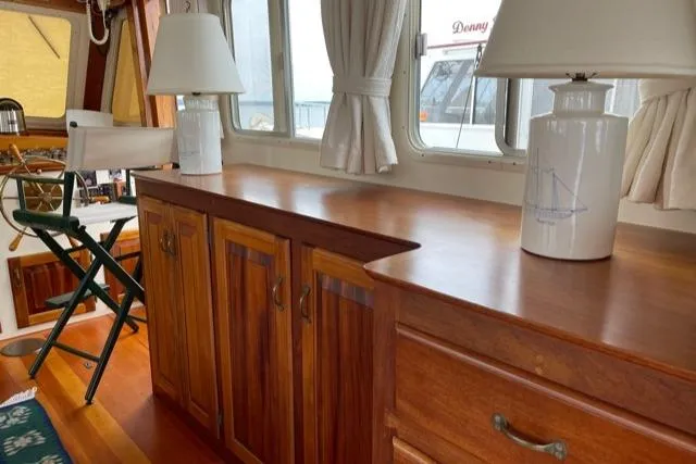 Slide: The Image of Interior of 1988 Holland Wesmac-Foley Flybridge Cruiser with wooden cabinetry. - 9