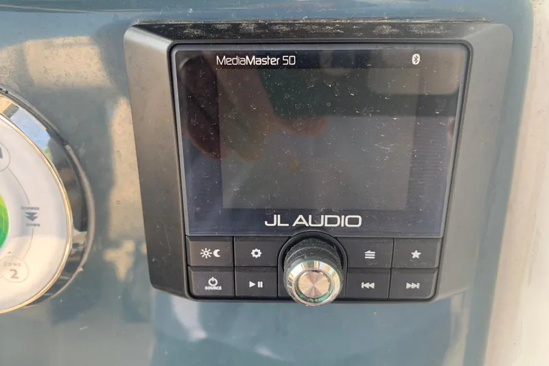 Slide: The Image of JL Audio MediaMaster 50 control panel on 2021 Tidewater 256 CC Adventure boat. - 10