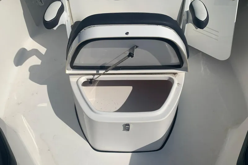 Slide: The Image of Open storage compartment on 2021 Tidewater 256 CC Adventure boat. - 23