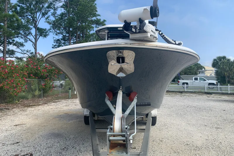 Slide: The Image of 2021 Tidewater 256 CC Adventure boat on trailer, parked outdoors. - 3