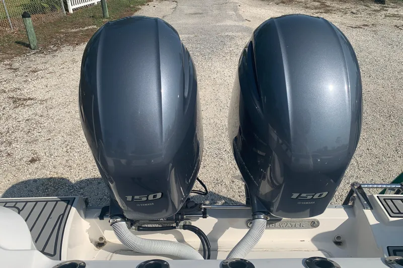 Slide: The Image of Twin Yamaha 150 engines on a 2021 Tidewater 256 CC Adventure boat. - 5