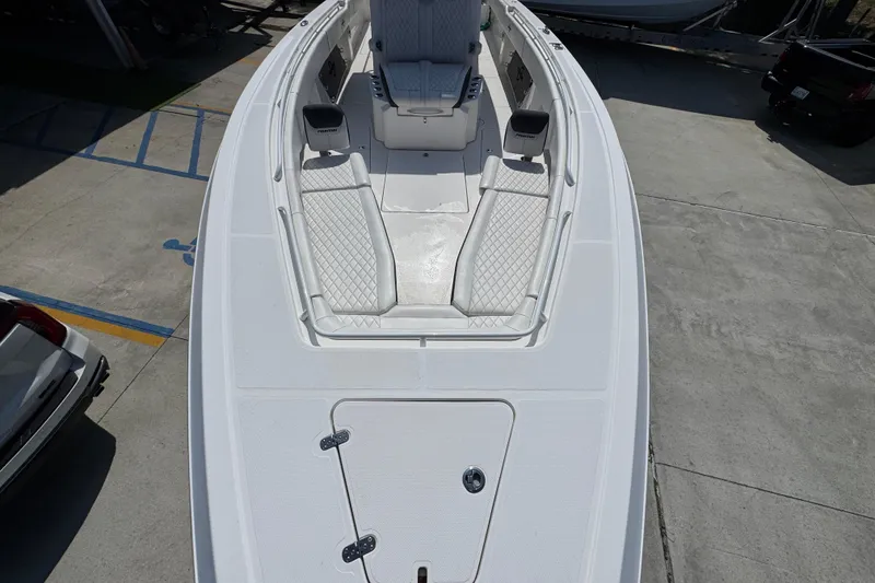 Slide: The Image of 2023 Fountain Bluewater 38 CC boat with spacious deck and seating area. - 17