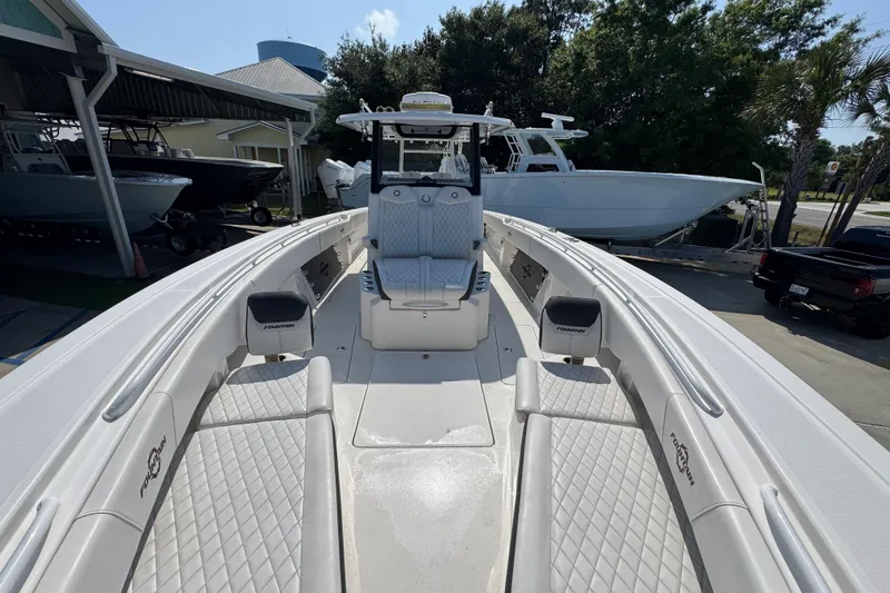 Slide: The Image of 2023 Fountain Bluewater 38 CC boat with spacious seating and modern design. - 19