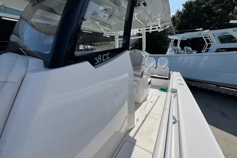 Slide: The Image of 2023 Fountain Bluewater 38 CC boat interior, showcasing sleek design and spacious seating. - 20