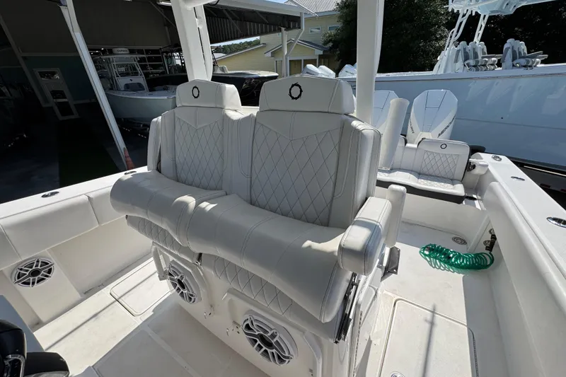 Slide: The Image of 2023 Fountain Bluewater 38 CC boat interior with luxurious seating and modern design. - 23