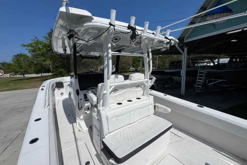 Slide: The Image of 2023 Fountain Bluewater 38 CC boat with white seating and modern helm station. - 31