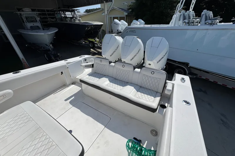 Slide: The Image of 2023 Fountain Bluewater 38 CC boat interior with triple Mercury engines. - 34