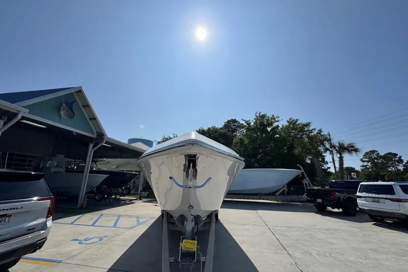 Slide: The Image of 2023 Fountain Bluewater 38 CC boat on trailer under sunny sky. - 5