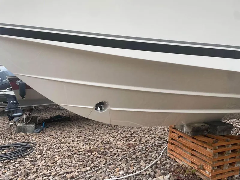 Slide: The Image of 2013 Pursuit 345 OS Offshore boat hull on dry dock with support blocks. - 5