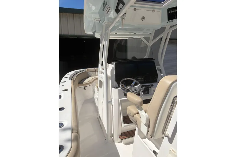 Slide: The Image of 2018 Seafox 288 Commander boat interior with helm, seating, and control panel. - 11