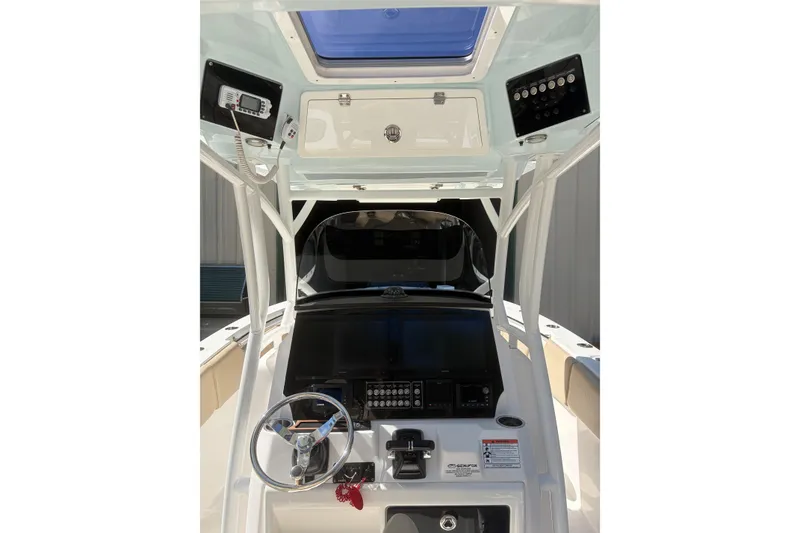 Slide: The Image of 2018 Seafox 288 Commander boat dashboard with steering wheel and control panel. - 12