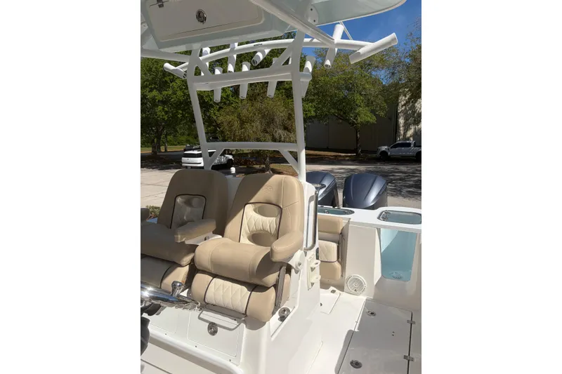 Slide: The Image of 2018 Seafox 288 Commander boat interior with beige seating and rod holders. - 14