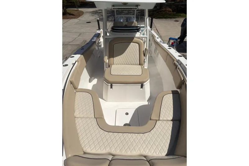Slide: The Image of 2018 Seafox 288 Commander boat interior with beige cushioned seating and spacious layout. - 20