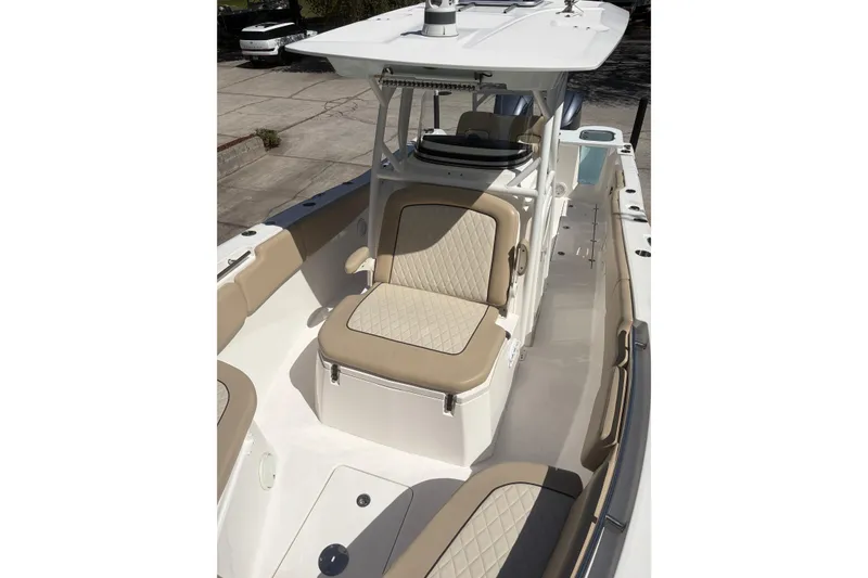 Slide: The Image of 2018 Seafox 288 Commander boat interior with beige seating and spacious deck. - 21