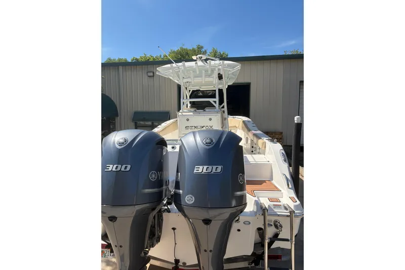 Slide: The Image of 2018 Seafox 288 Commander boat with dual Yamaha 300 engines, docked outdoors. - 24