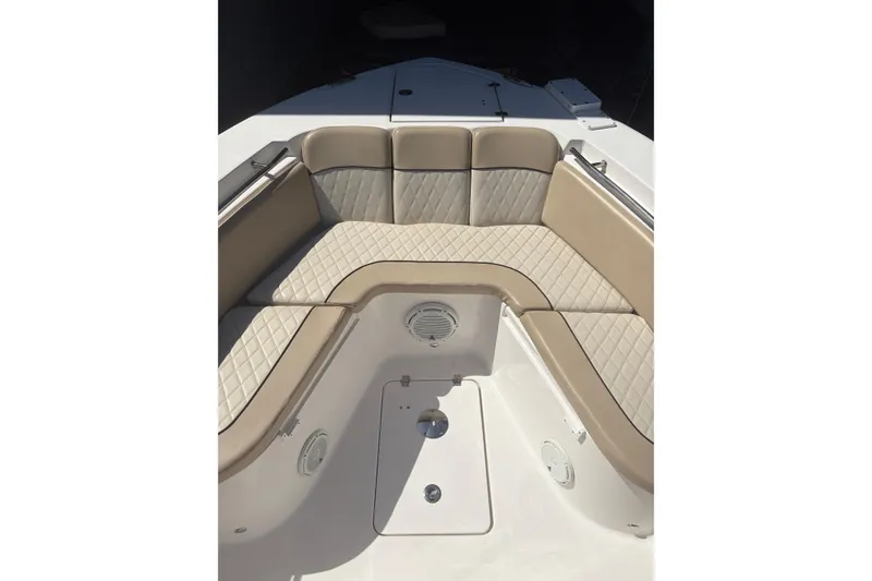 Slide: The Image of Luxurious seating area on a 2018 Seafox 288 Commander boat, featuring beige quilted upholstery. - 26