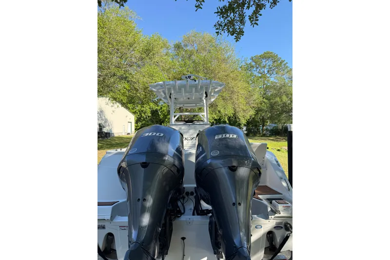 Slide: The Image of 2018 Seafox 288 Commander boat with dual 300 horsepower engines, parked outdoors. - 3