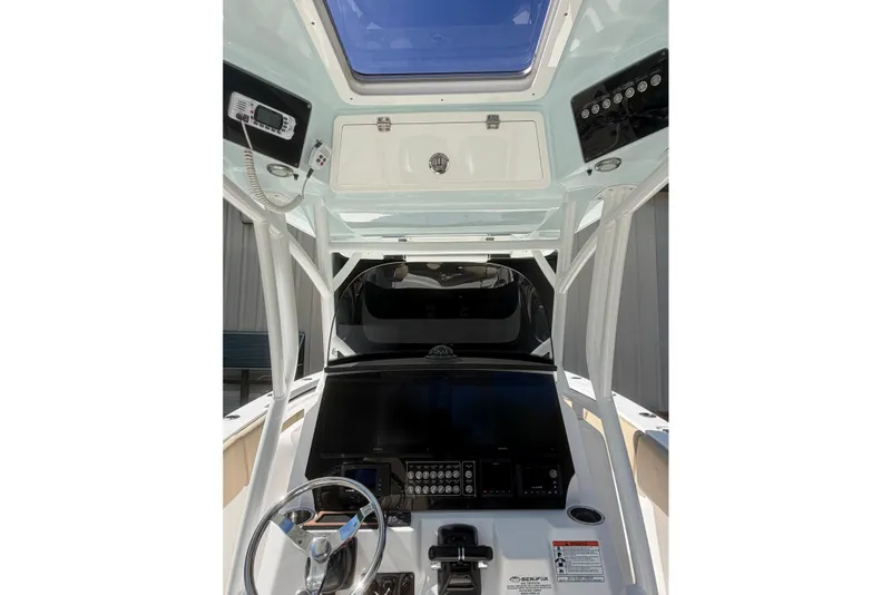 Slide: The Image of 2018 Seafox 288 Commander boat cockpit with steering wheel and control panel. - 4
