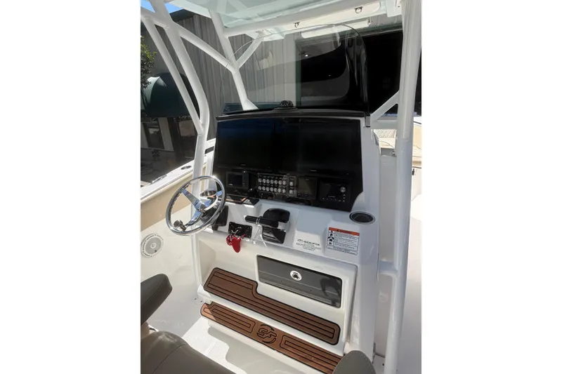 Slide: The Image of 2018 Seafox 288 Commander boat console with steering wheel and control panel. - 5