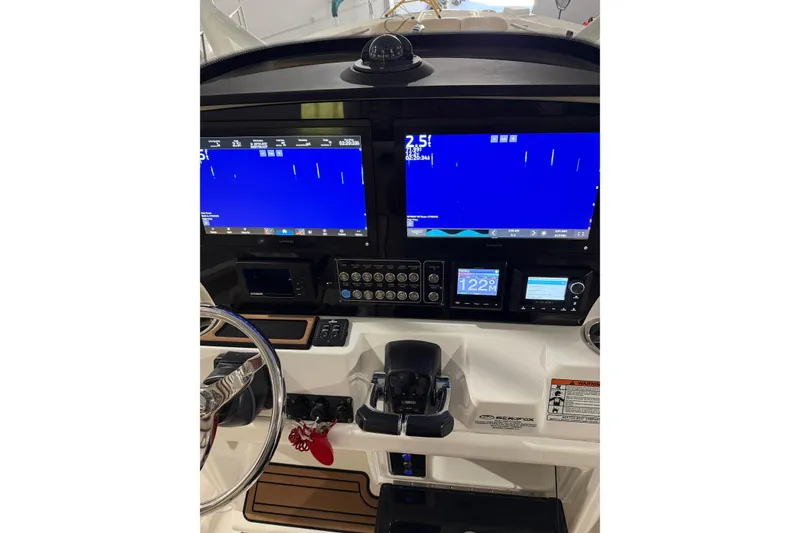 Slide: The Image of 2018 Seafox 288 Commander dashboard with dual screens and navigation controls. - 7