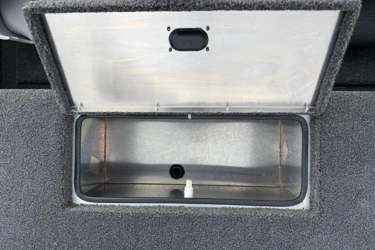 Slide: The Image of Open storage compartment in 2026 Crestliner 1600 Storm boat. - 12