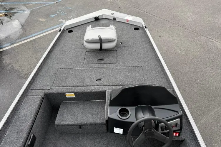 Slide: The Image of 2026 Crestliner 1600 Storm boat interior with steering console and seating. - 3