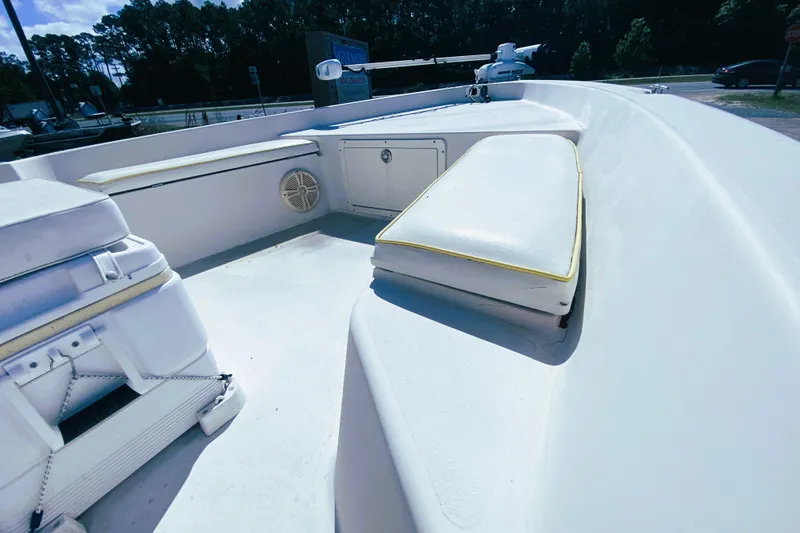 Slide: The Image of 1999 Pathfinder 2200 Tournament Edition boat interior with seating and storage compartments. - 10