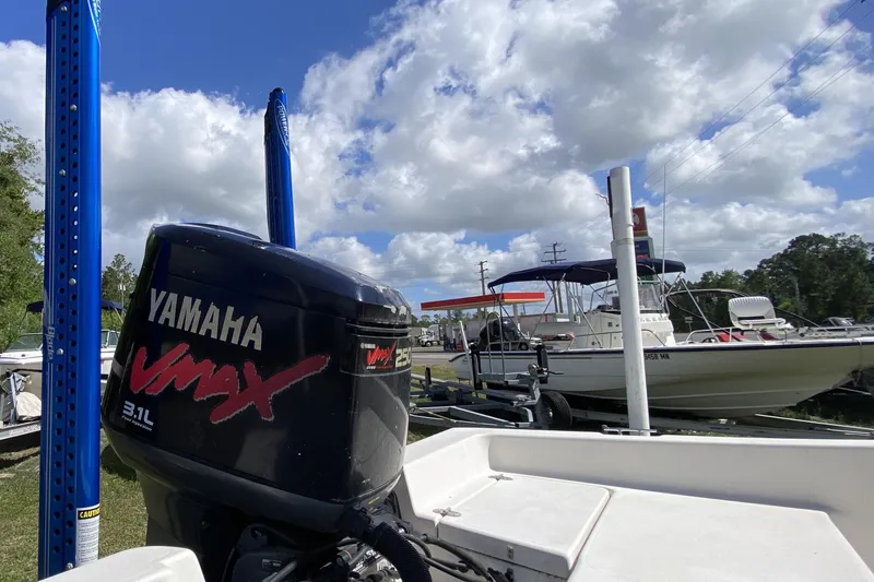 Slide: The Image of 1999 Pathfinder 2200 Tournament Edition boat with Yamaha VMAX engine, docked under blue sky. - 12