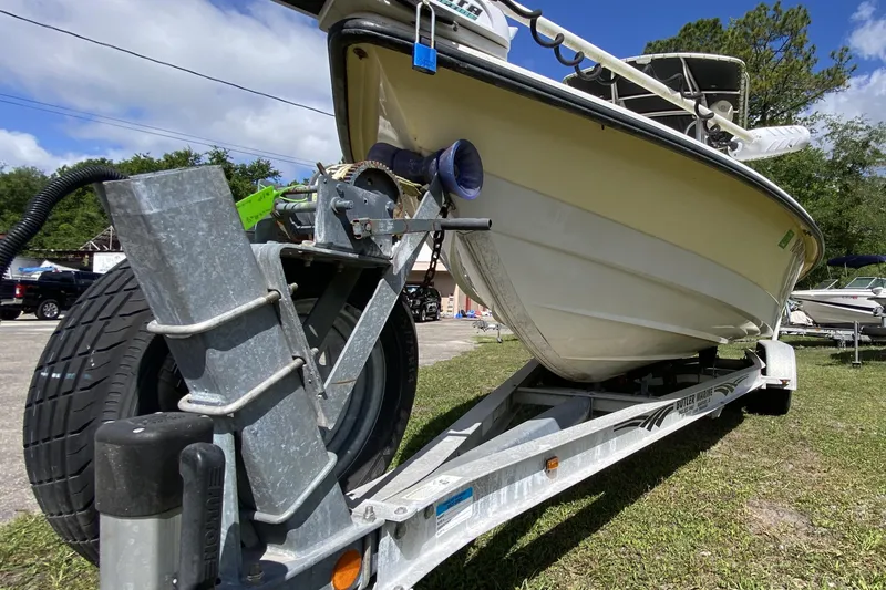 Slide: The Image of 1999 Pathfinder 2200 Tournament Edition boat on trailer, parked outdoors. - 15