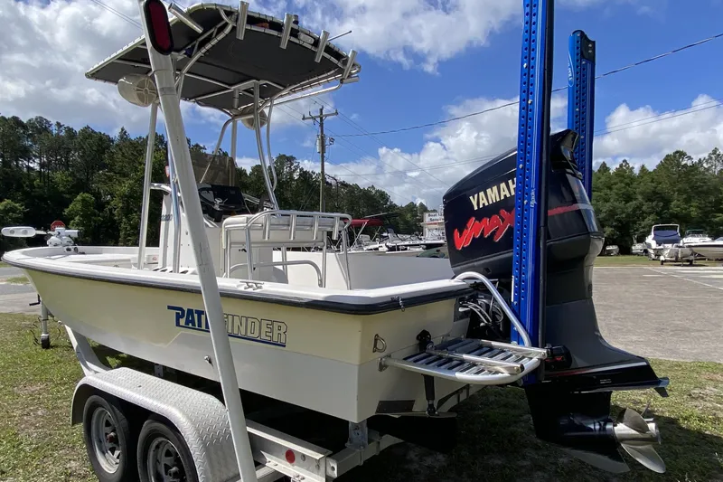 Slide: The Image of 1999 Pathfinder 2200 Tournament Edition boat with Yamaha engine on trailer. - 3