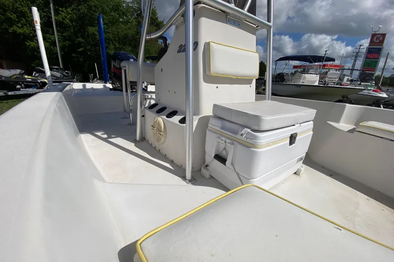 Slide: The Image of 1999 Pathfinder 2200 Tournament Edition boat interior with seating and storage. - 8