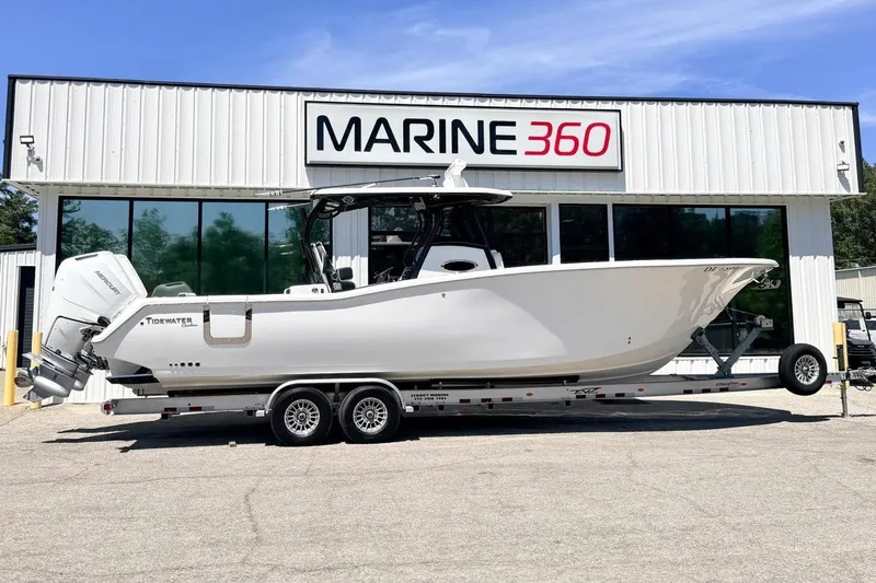 The Image of 2024 Tidewater 320 CC Adventure boat on trailer at Marine 360 dealership. - 0