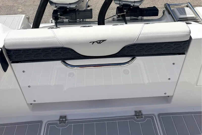 Slide: The Image of 2024 Tidewater 320 CC Adventure boat with dual Mercury outboard engines. - 11