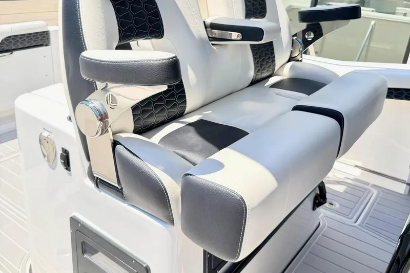 Slide: The Image of 2024 Tidewater 320 CC Adventure boat seating with modern design and comfort features. - 19