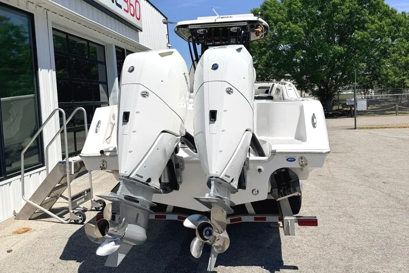 Slide: The Image of 2024 Tidewater 320 CC Adventure boat with dual engines at Marine 360 dealership. - 2
