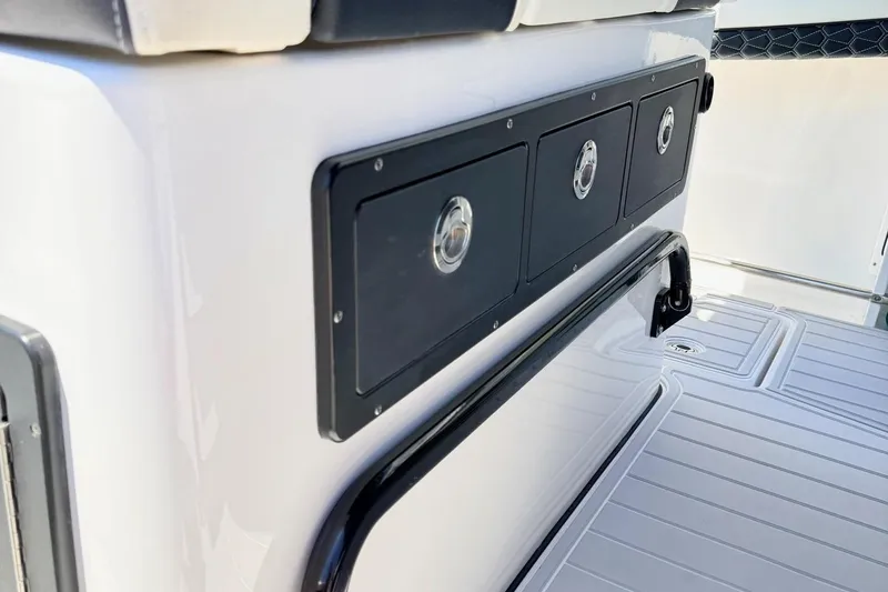 Slide: The Image of 2024 Tidewater 320 CC Adventure boat interior with storage compartments and seating. - 22