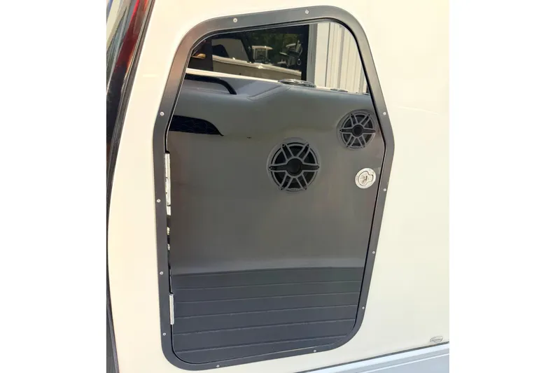 Slide: The Image of 2024 Tidewater 320 CC Adventure cabin door with speakers and sleek design. - 24