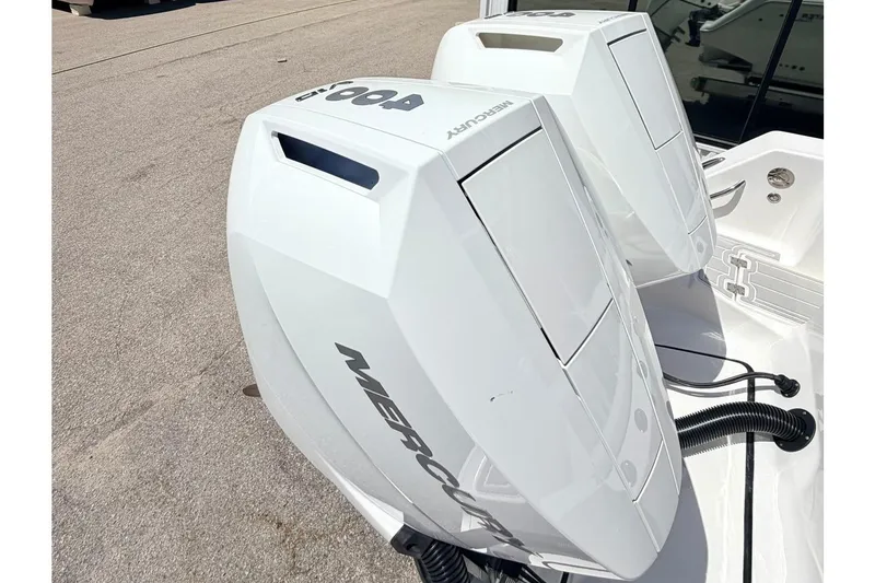 Slide: The Image of 2024 Tidewater 320 CC Adventure boat with dual Mercury outboard engines. - 3