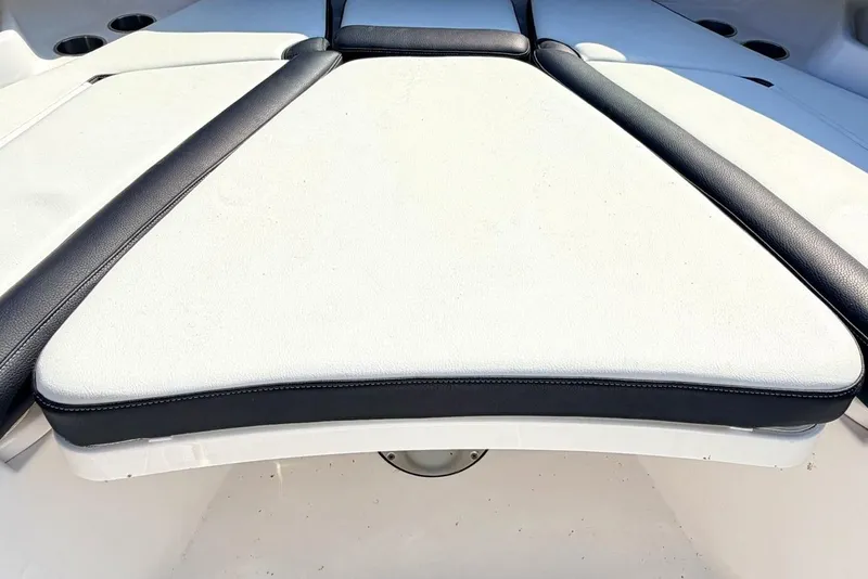 Slide: The Image of 2024 Tidewater 320 CC Adventure boat interior with cushioned seating and speaker system. - 35