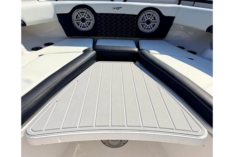 Slide: The Image of 2024 Tidewater 320 CC Adventure boat interior with seating and speakers. - 36