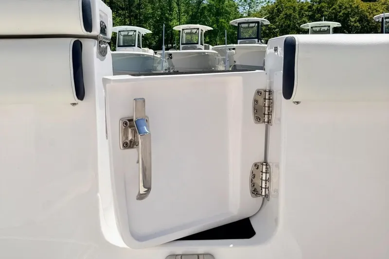 Slide: The Image of 2024 Tidewater 320 CC Adventure boat door open, showcasing sleek design and sturdy hinges. - 4