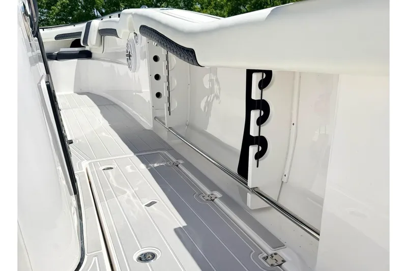 Slide: The Image of 2024 Tidewater 320 CC Adventure boat deck with sleek design and storage features. - 5