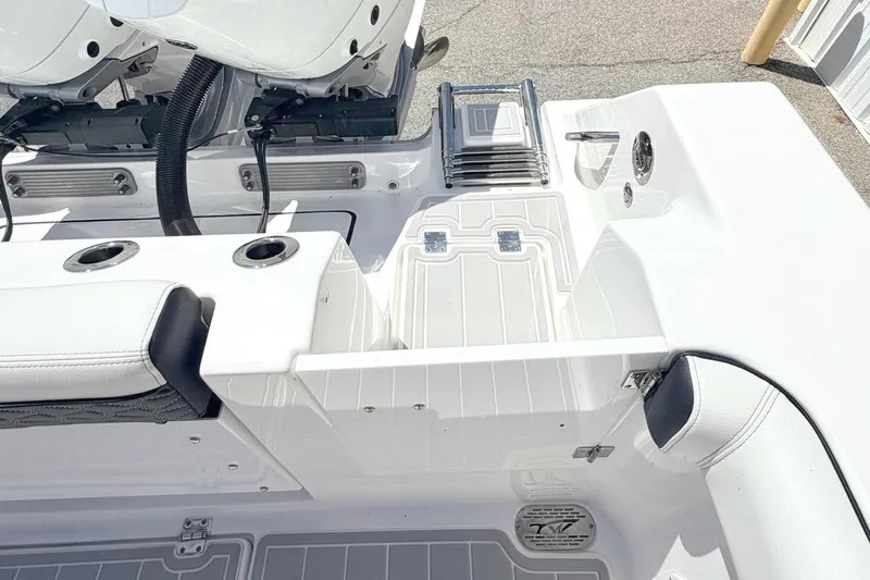 Slide: The Image of 2024 Tidewater 320 CC Adventure boat with Mercury engine, featuring sleek deck design. - 8