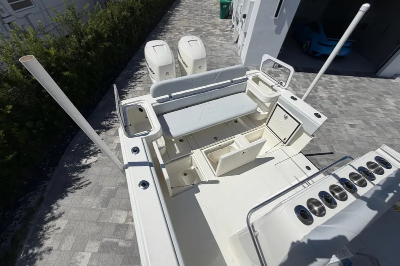 Slide: The Image of 2021 SeaVee 322Z boat with dual engines, spacious deck, and storage compartments. - 10