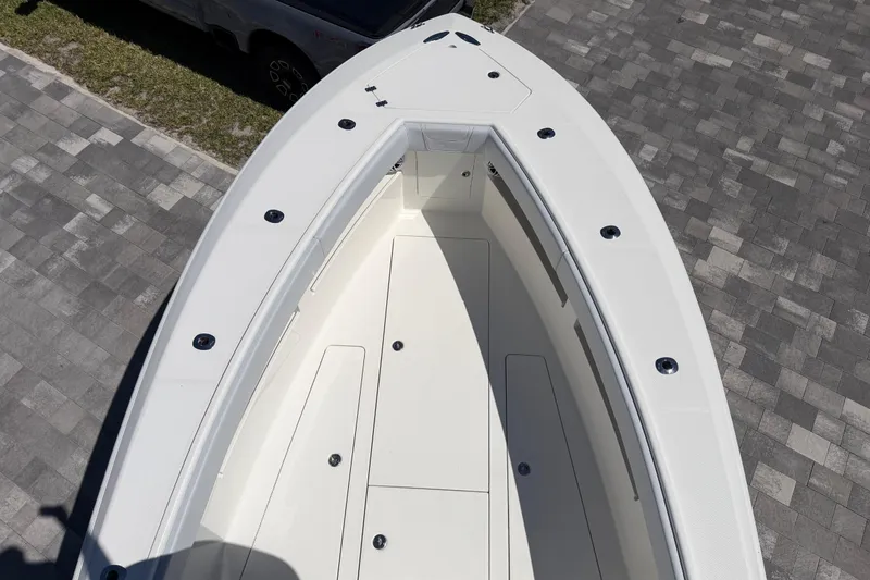 Slide: The Image of 2021 SeaVee 322Z boat deck, aerial view, parked on paved surface. - 17