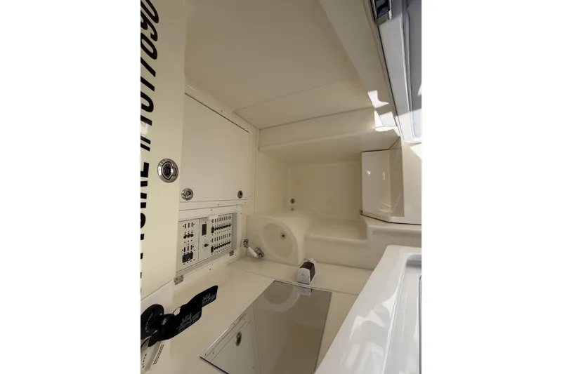 Slide: The Image of 2021 SeaVee 322Z interior cabin with control panel and storage compartments. - 22